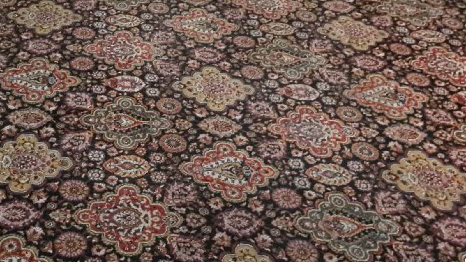 Victorian-style wool carpet restored with colours and pattern fully visible after specialist cleaning