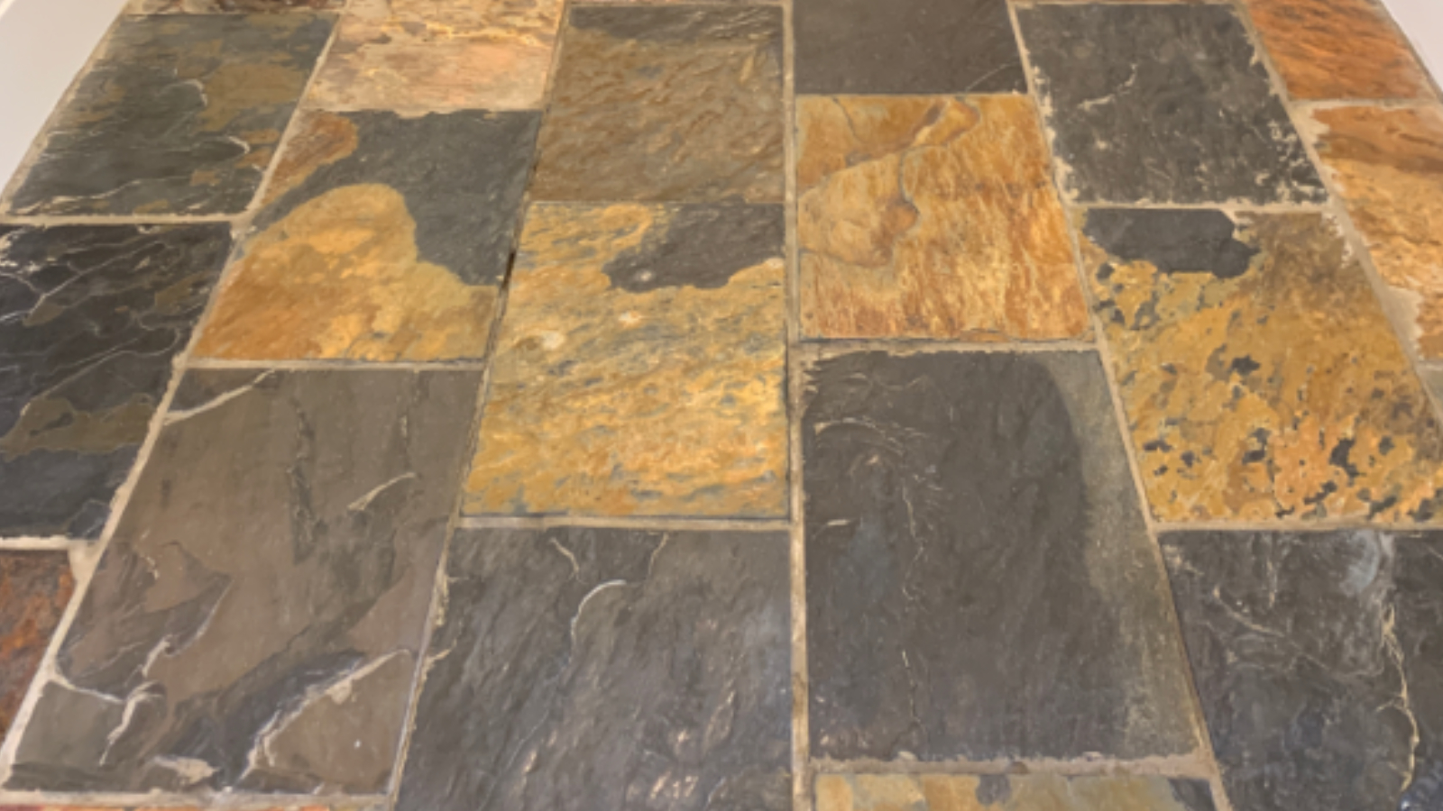 African slate hallway floor in Newcastle before professional cleaning and sealing
