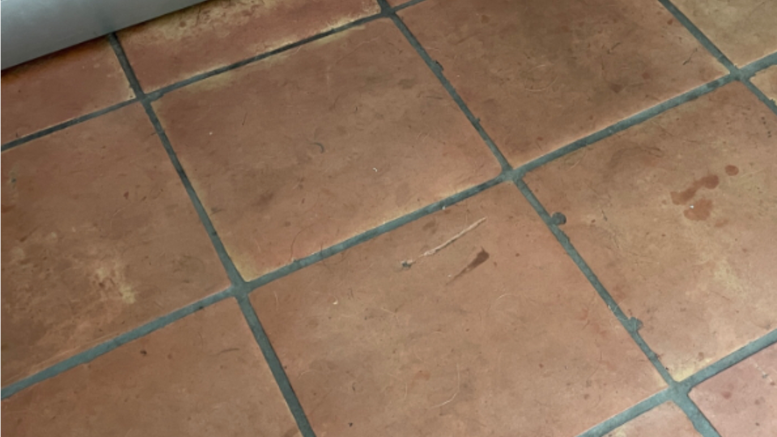 Traditional quarry tile floor in Ryton before cleaning and sealing showing dull contamination