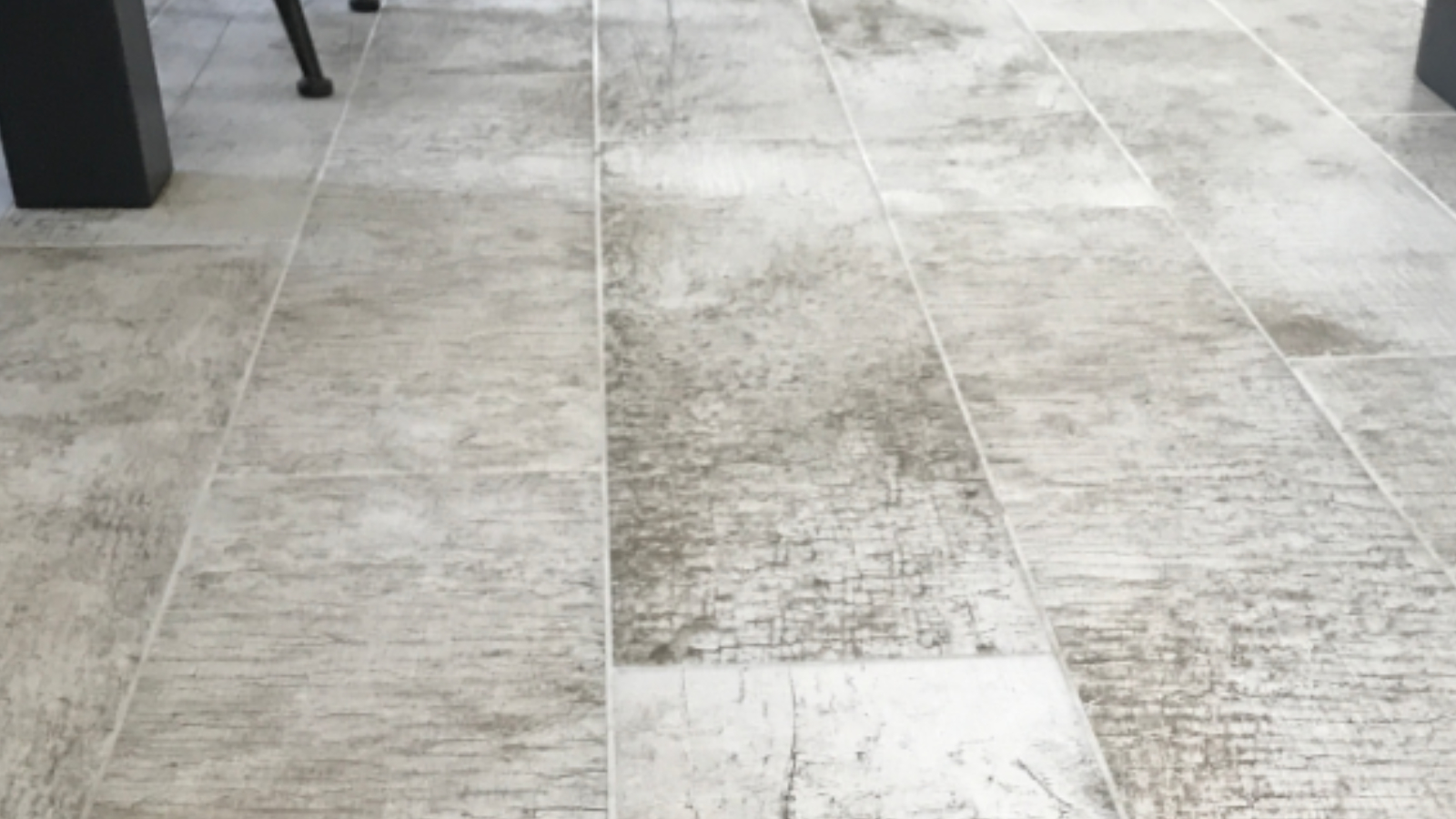 Driftwood-effect ceramic floor after professional tile and grout cleaning restored a fresher appearance
