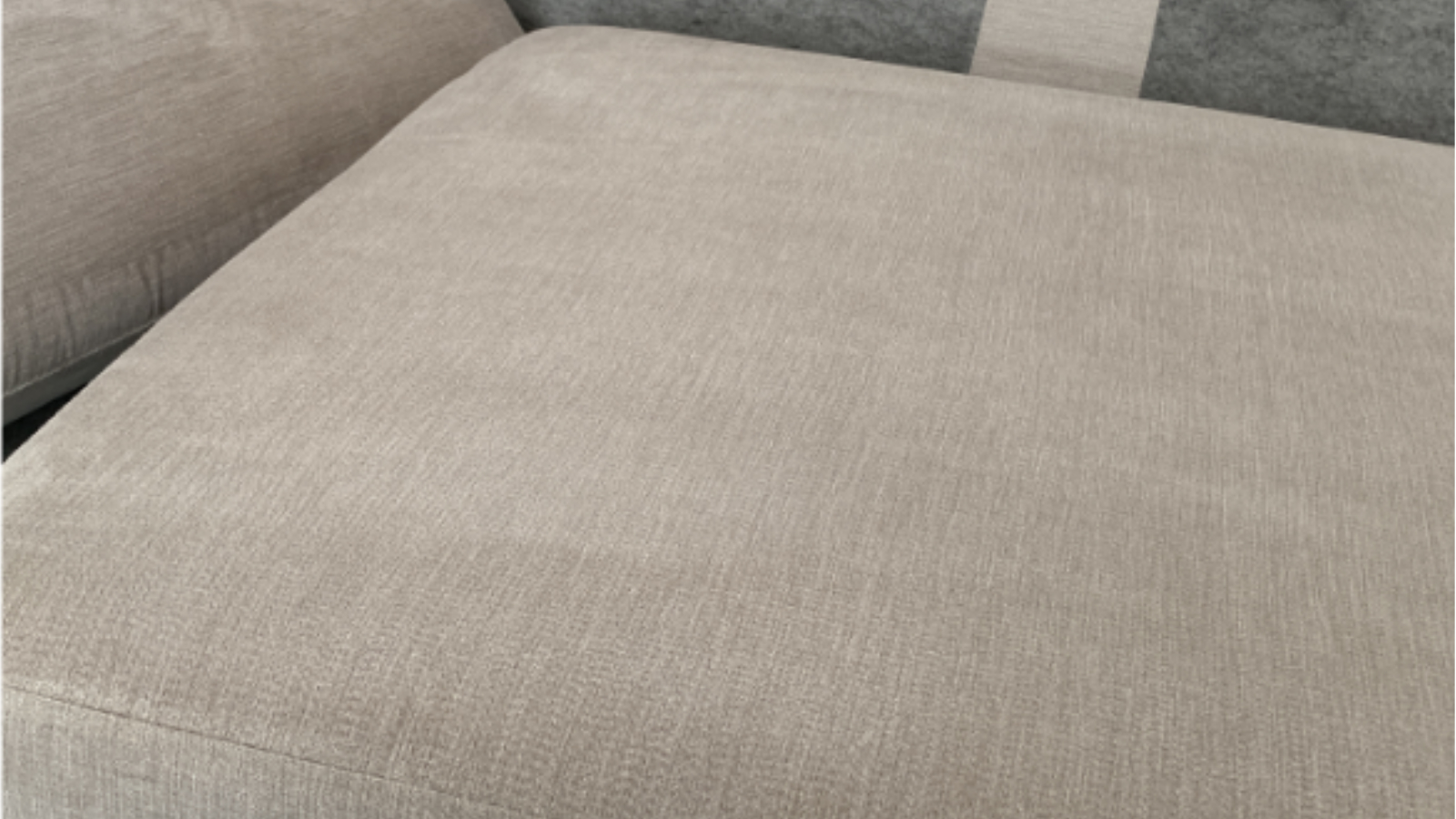 Family fabric sofa after low-moisture upholstery cleaning removed water marks and staining