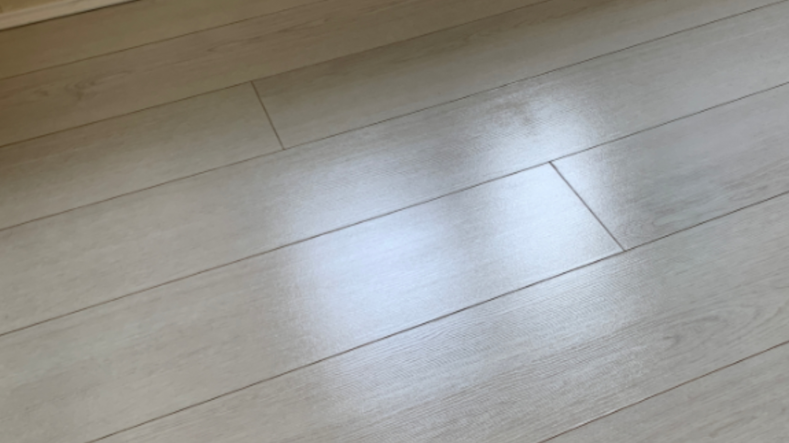 Bedroom LVT floor in a rental property after end-of-tenancy cleaning and polishing restored a cleaner finish