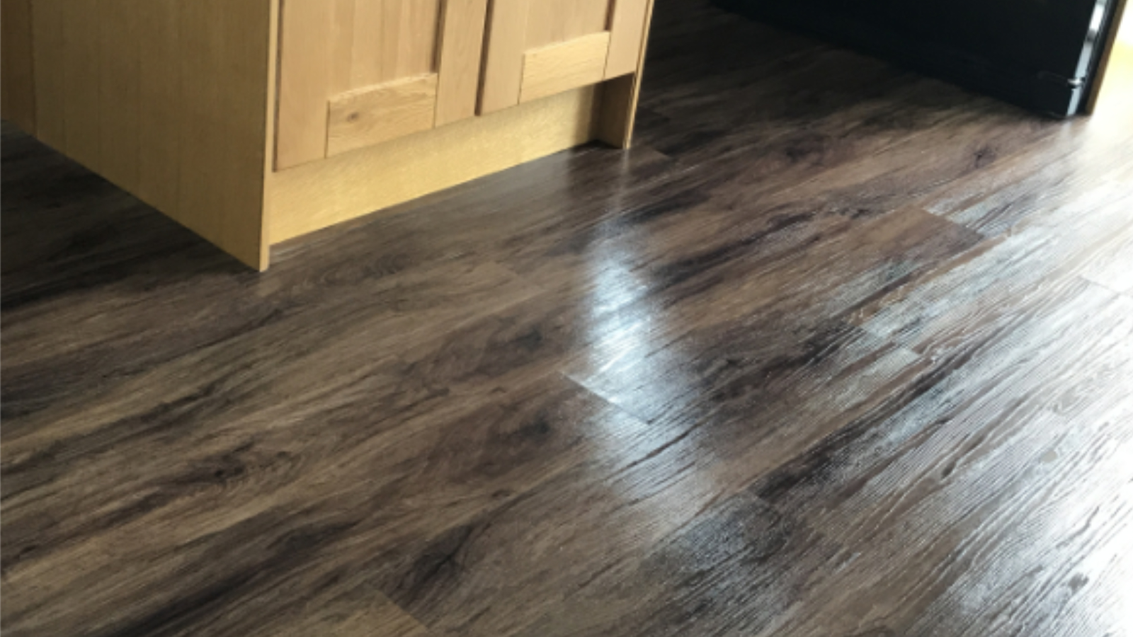 Karndean LVT floor in County Durham after stripping, cleaning and re-polishing restored a brighter finish