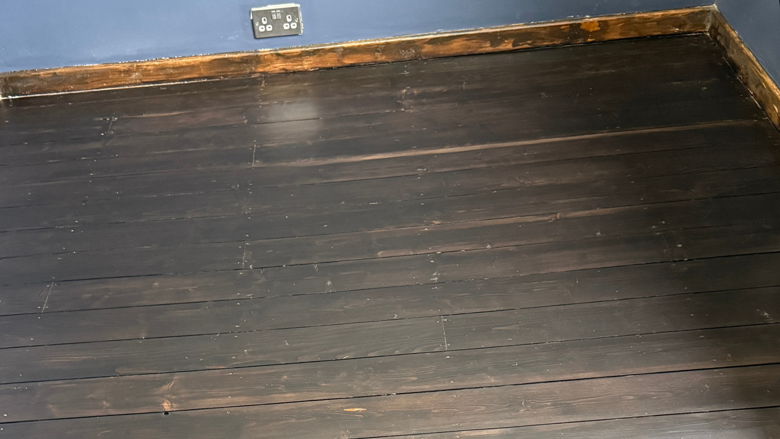 Restored pine floorboards stained walnut and finished with Bona Mega EVO Silk Matt
