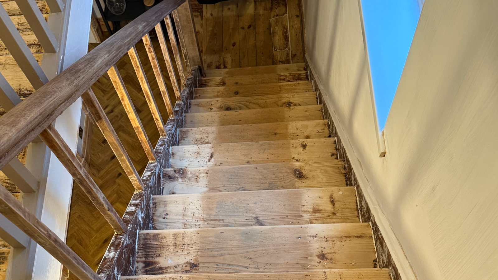 1930s pine staircase before sanding with bleaching and worn finish